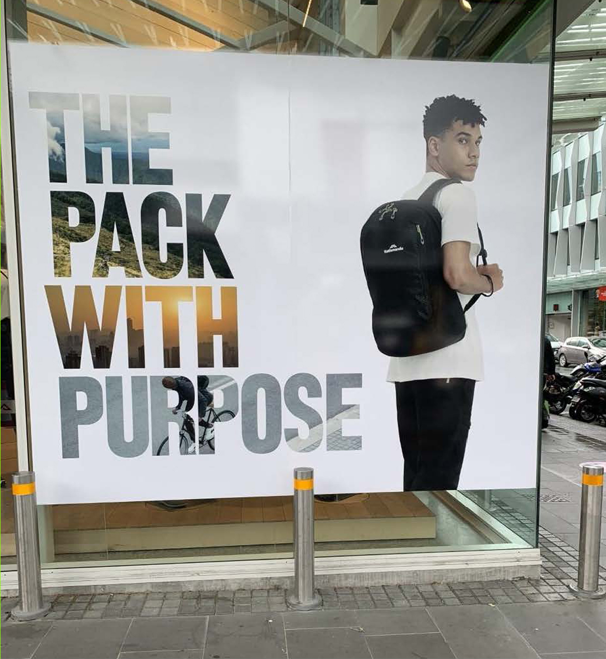 outdoor advertisement featuring a person with a backpack