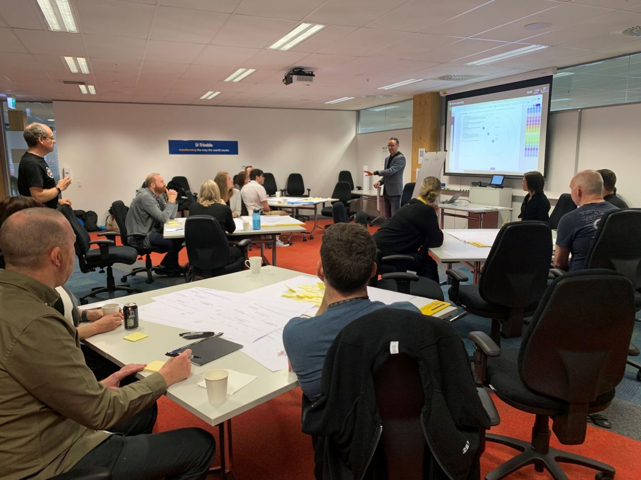 Image of a room of people participating in a workshop