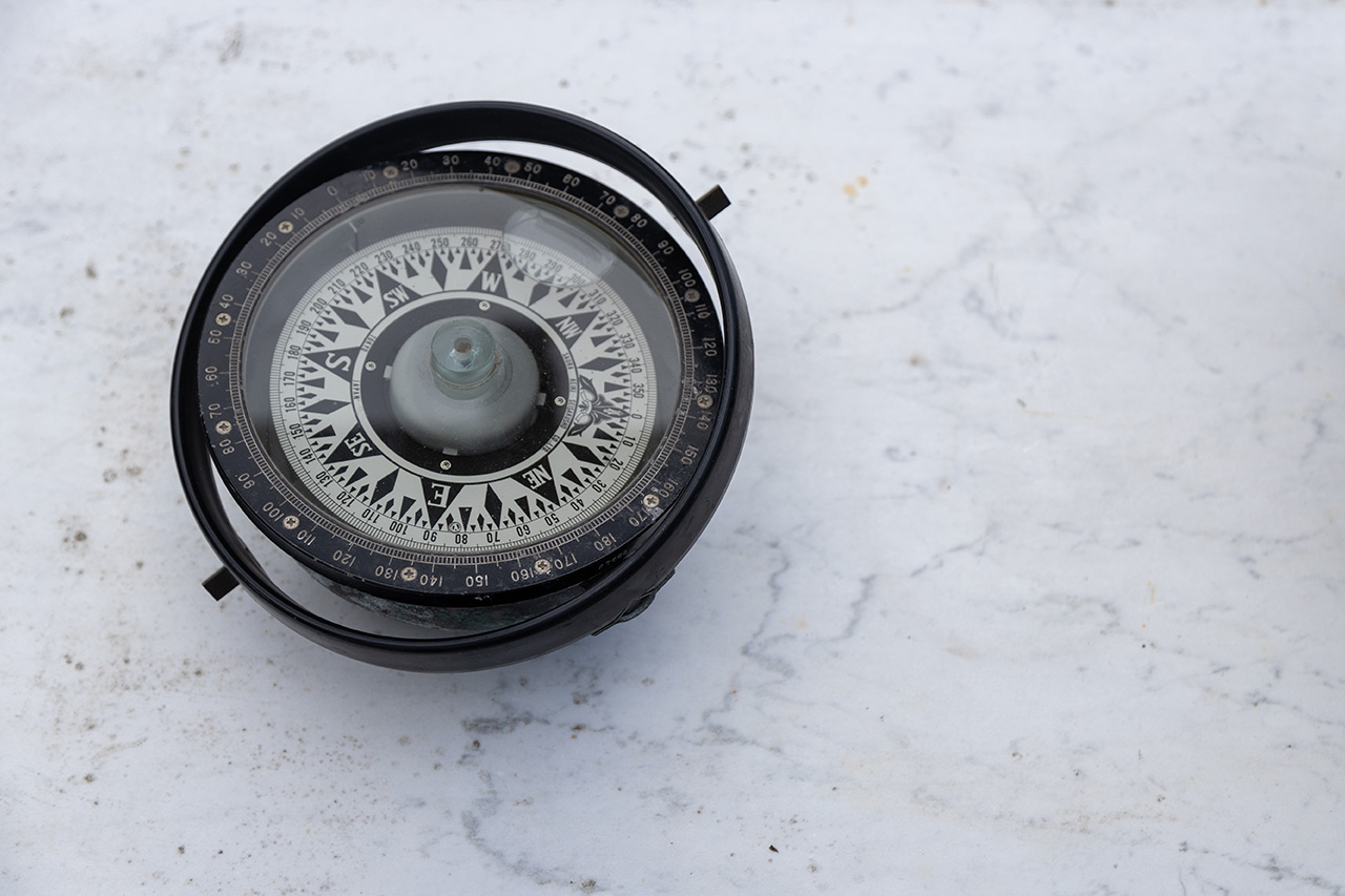 Dorenda-Britten-Our-Team image of a compass on a table
