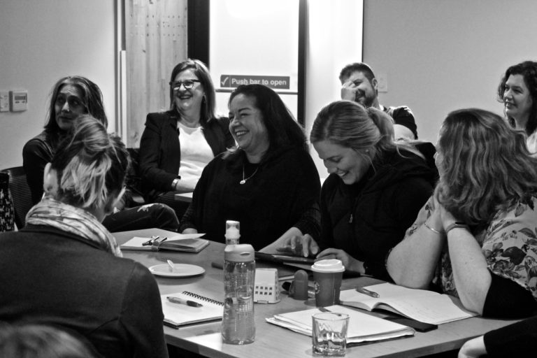 Image of a group of learners around a table